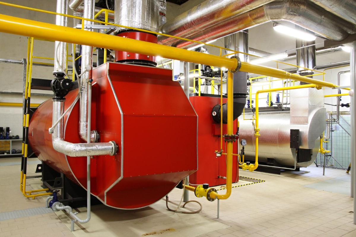 Modern boiler installation highlighting heat transfer efficiency, fluid flow control, and energy balance essential for safe and reliable boiler operation.
