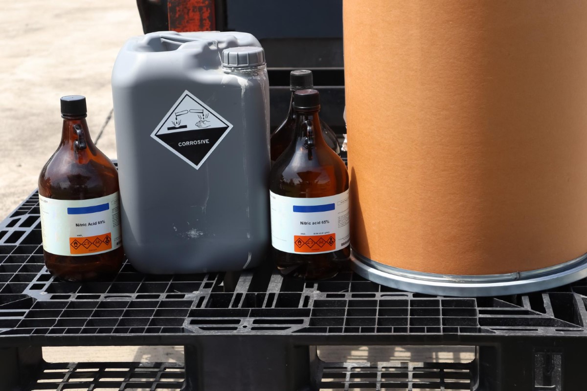 Chemical containers must be correctly labeled, segregated, and positioned to avoid incompatible interactions, ensuring controlled risk management and safe handling of hazardous substances.