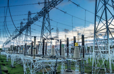 High voltage power transformer substation before russian bombed on Ukraine territory. High voltage tower with blue sky and sunset. Curso Manutenção de Subestação Elétrica.
