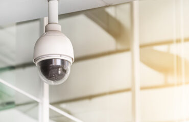 Modern public CCTV camera on wall. Recording cameras for monitor Curso CFTV