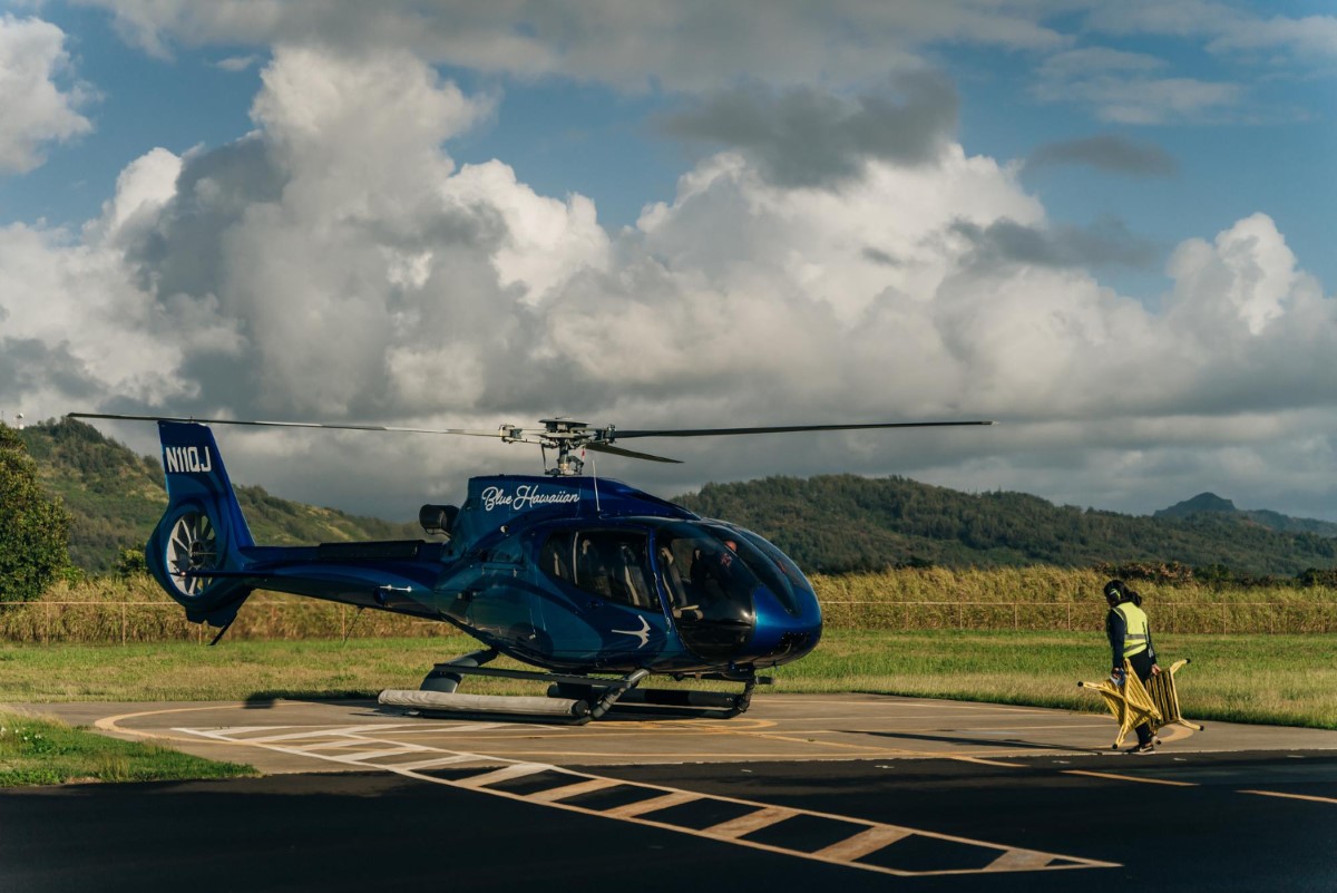 Pre-boarding inspections and ground signals support hazard identification and reinforce flight safety prior to transport to the platform.