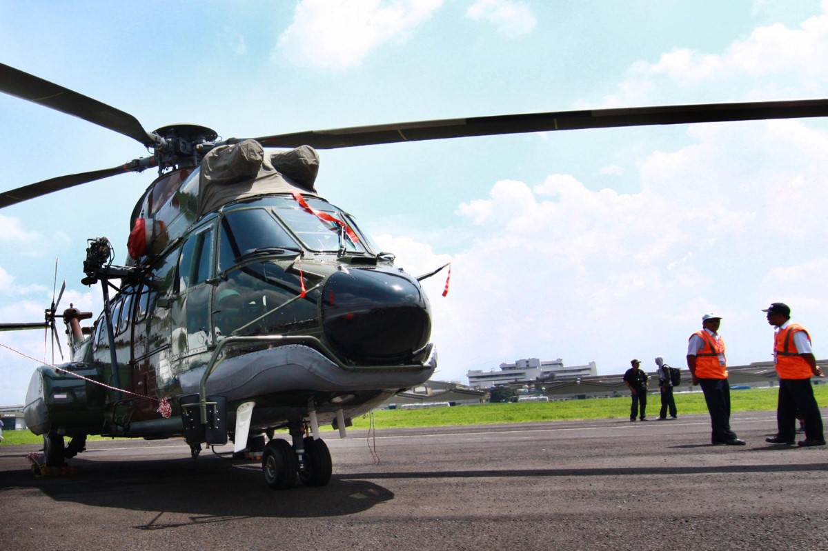 Crew members verify equipment integrity and communication routines, ensuring full compliance with offshore safety requirements before departure.