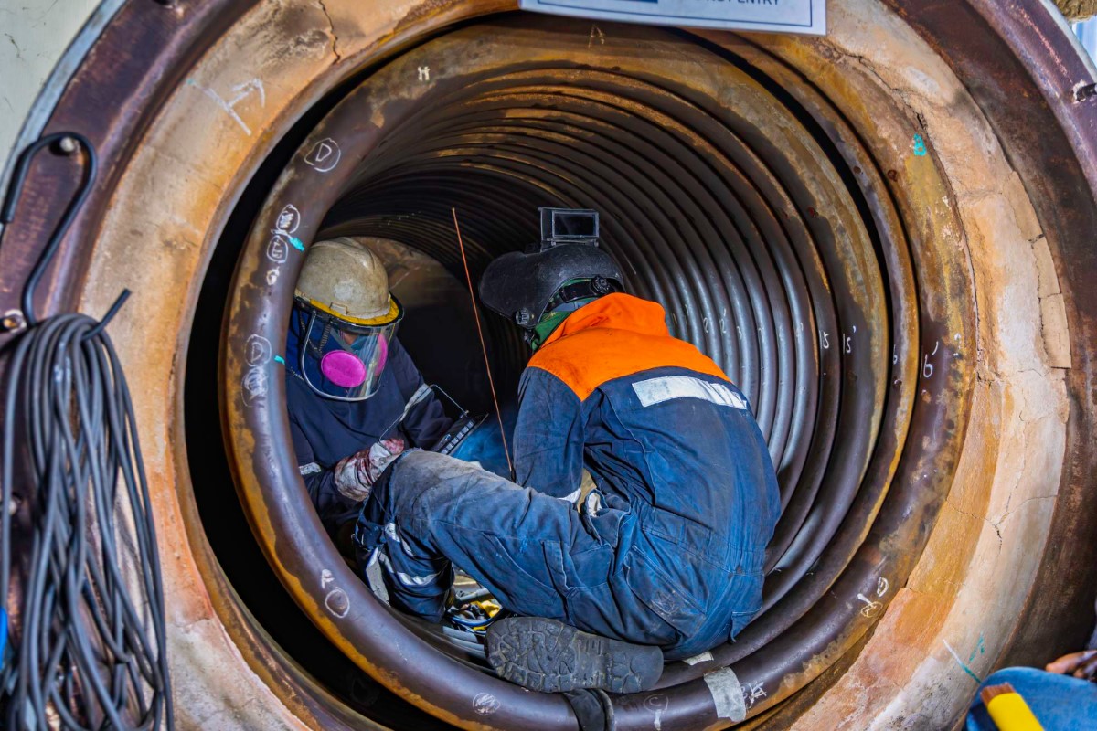 Safe entry begins with atmosphere testing and clear communication between the authorized worker and the watchman.